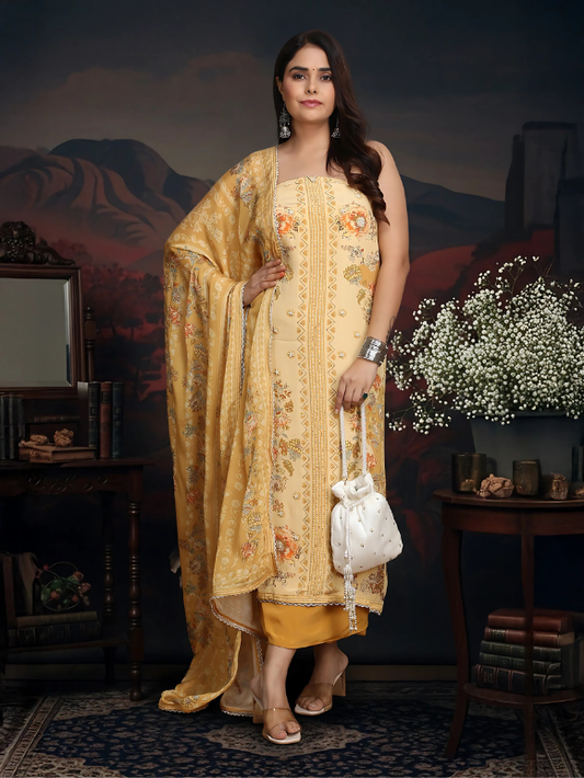 Pastel yellow embroidered suit is adorned with delicate floral motifs and paired with a rich dupatta