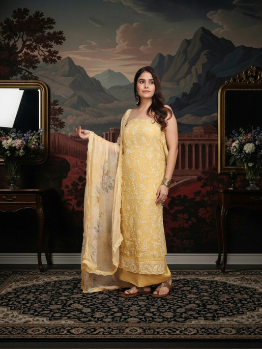 Pastel yellow suit adorned with delicate embroidery