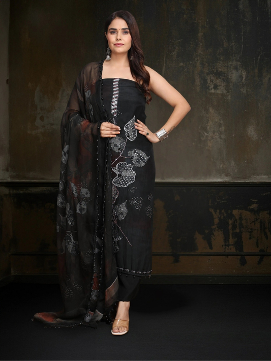 Classic black ensemble with subtle embellishments and a flowy dupatta