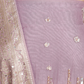 Close-up of shimmer-detailed suit in a dreamy mauve hue for evening glam