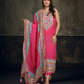 Vibrant pink ethnic ensemble with intricate mirror work and scalloped printed dupatta 