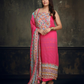 Vibrant pink ethnic ensemble with intricate mirror work and scalloped printed dupatta 