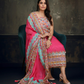 Vibrant pink ethnic ensemble with intricate mirror work and scalloped printed dupatta 