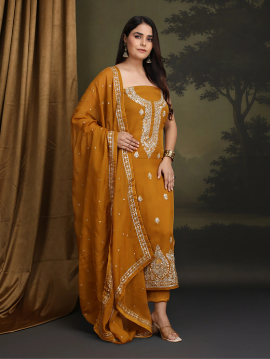 Mustard yellow traditional outfit with intricate patterns