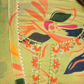 Close-up of lightweight and stylish green suit with bold floral prints