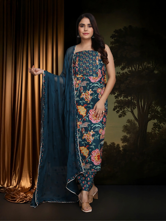 Rich teal floral ensemble with its flowy dupatta 