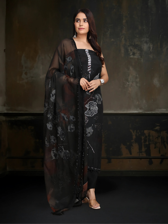 Classic black ensemble with subtle embellishments and a flowy dupatta