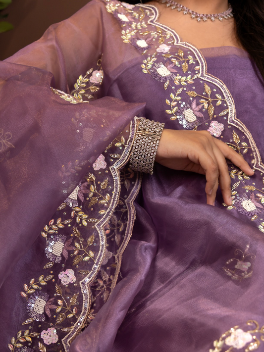 Close-up of  coordinated shimmer-organza kurta and bottom with a soft muslin dupatta 